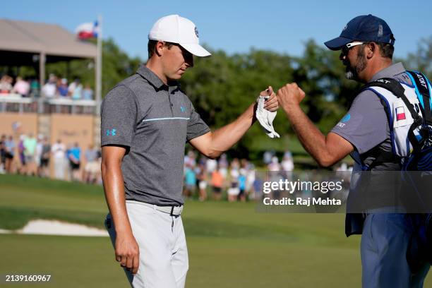 Jordan Spieth of the United States celebrates after doing a hole in one on the 16th hole during the first round of the Valero Texas Open at TPC San...