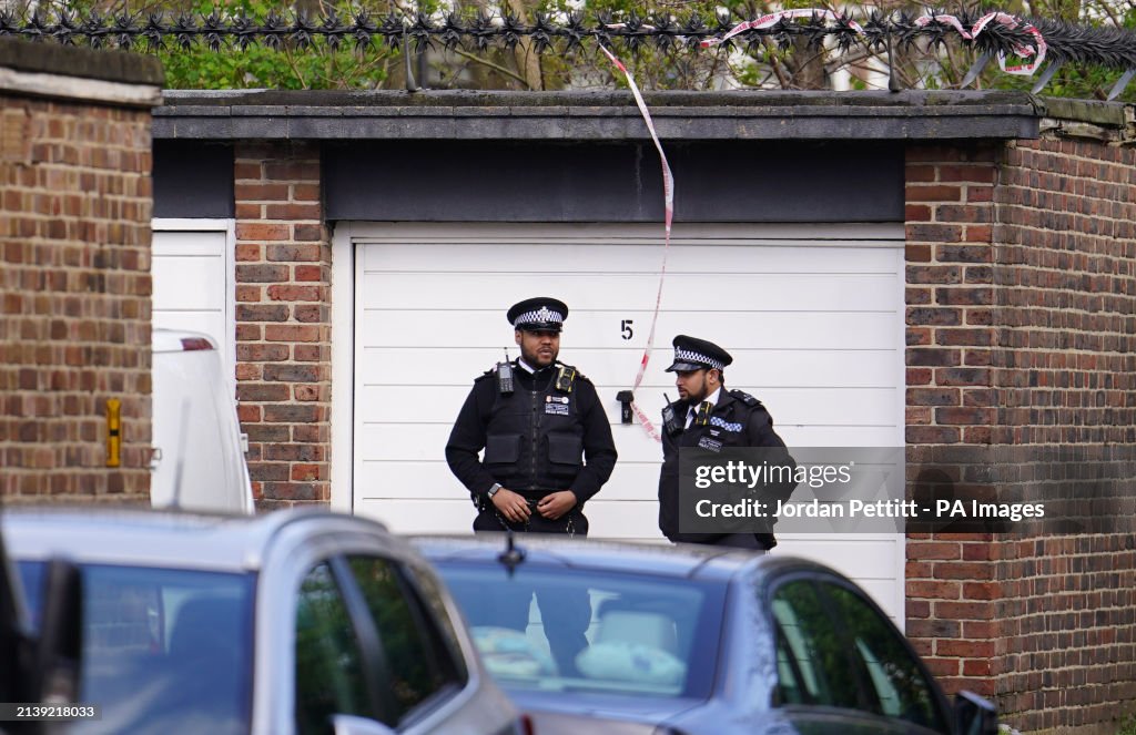 Police Hackney Police near the scene where a woman was found unresponsive in a car ...