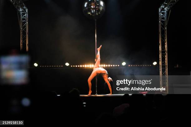 Blackstage pole dancer performs on stage at Clapham Grand on April 6, 2024 in London, England. Show organisers Blackstage are committed to making the...