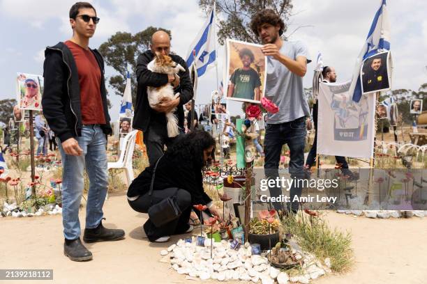 Family visit the marker of Noa Farage who was killed on the October 7 Hamas deadly attack at the Nova music festival on April 7, 2024 in Re'eim,...