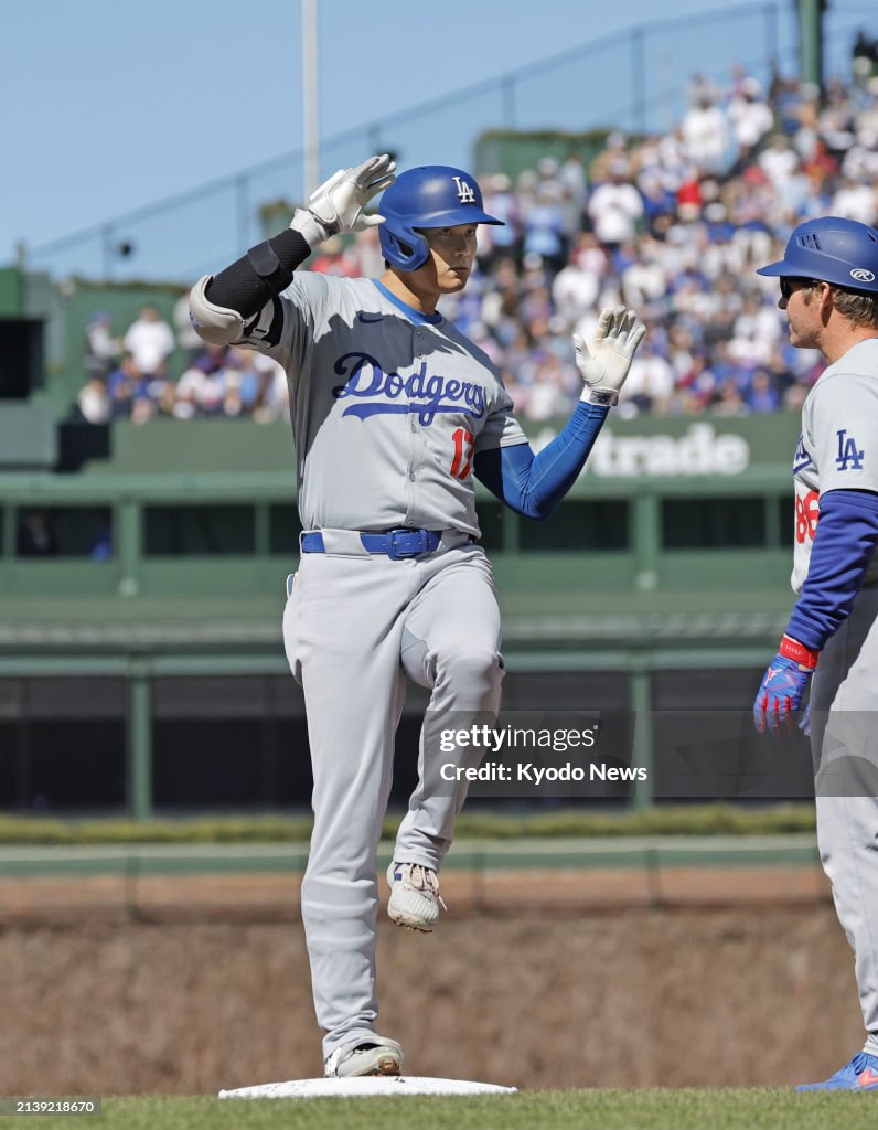 Shohei Ohtani Of The Los Angeles Dodgers Poses On The First Base