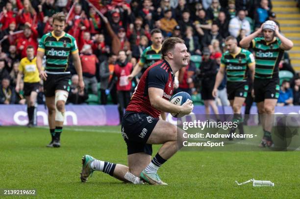 Munster's Sean O'Brien celebrates scoring his side's first try during the Investec Champions Cup Round of 16 match between Northampton Saints and...