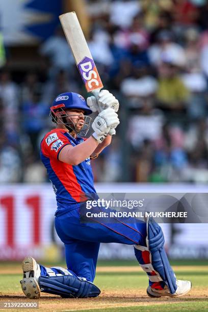 Delhi Capitals' David Warner plays a shot during the Indian Premier League Twenty20 cricket match between Mumbai Indians and Delhi Capitals at the...