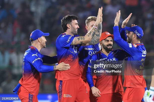 Players from Royal Challengers Bengaluru are celebrating the wicket of Rajasthan Royals batter Yashasvi Jaiswal during the Indian Premier League 2024...