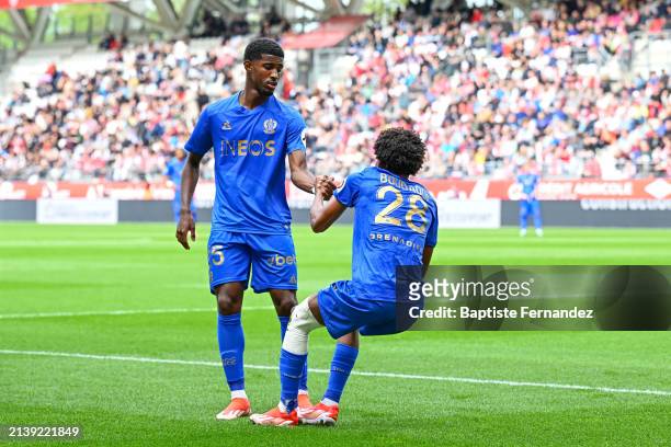 Mohamed Ali CHO and Hicham BOUDAOUI of Nice during the Ligue 1 Uber Eats match between Reims and Nice at Stade Auguste Delaune on April 7, 2024 in...