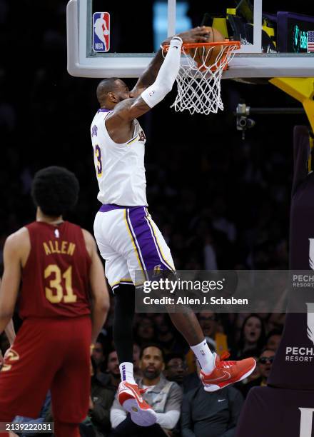 Los Angeles, CA Lakers forward LeBron James, #23, right, dunks the ball as Cavaliers center Jarrett Allen, watches in the second half at Crypto.com...