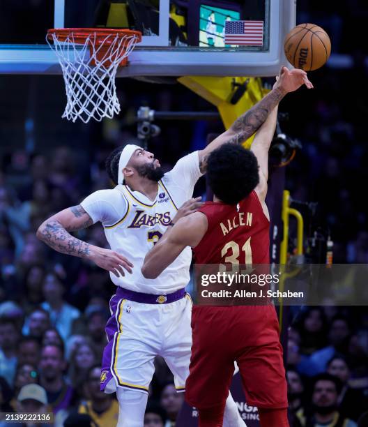 Los Angeles, CA Lakers forward Anthony Davis, #3, left, blocks a shot by Cavaliers center Jarrett Allen in the first half at Crypto.com Arena in Los...