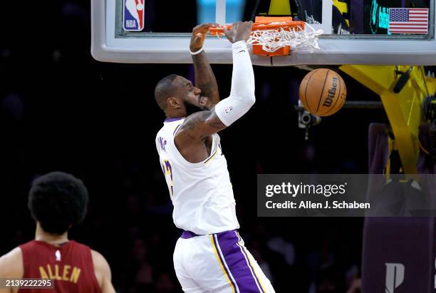 Los Angeles, CA Lakers forward LeBron James, #23, right, dunks the ball as Cavaliers center Jarrett Allen, watches in the second half at Crypto.com...