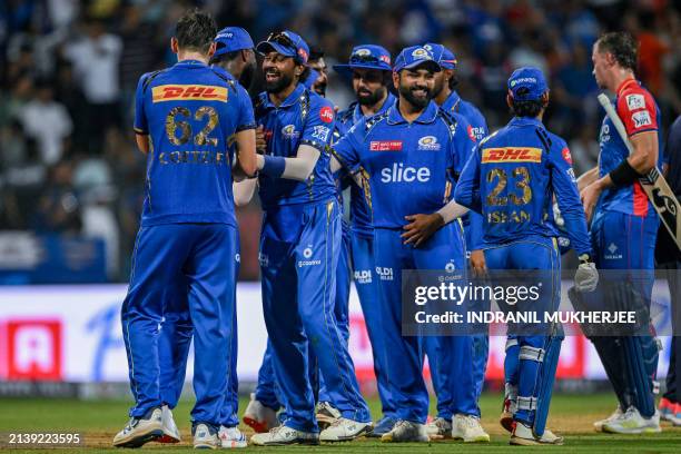 Mumbai Indians' players celebrate after winning the Indian Premier League Twenty20 cricket match between Mumbai Indians and Delhi Capitals at the...