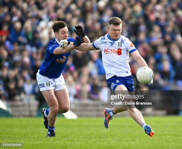 Monaghan , Ireland - 7 April 2024; Conor McCarthy of Monaghan in action against Gerard Smith of Cavan during the Ulster GAA Football Senior...