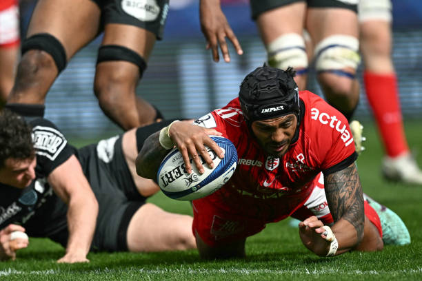 Toulouse's New Zealander centre Pita Ahki dives to score a try during the European Rugby Champions Cup round of 16 rugby union match between Stade...