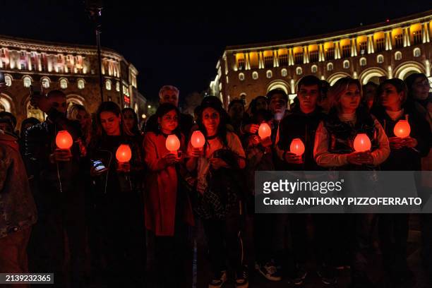 Yerevan, Armenia. On Holy Saturday, Armenians assemble at Saint Sarkis Cathedral to partake in the Easter Vigil mass before embarking on a candlelit...