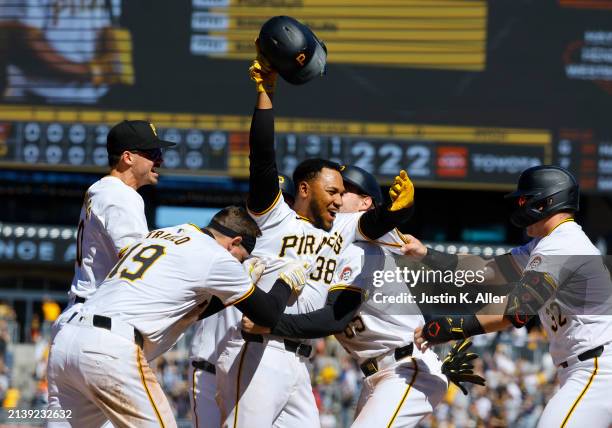 Edward Olivares of the Pittsburgh Pirates celebrates with teammates after defeating the Baltimore Orioles 3-2 during interleague play at PNC Park on...