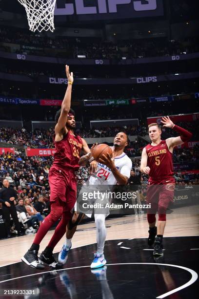 Norman Powell of the LA Clippers handles the ball during the game against the Cleveland Cavaliers on April 7, 2024 at Crypto.Com Arena in Los...