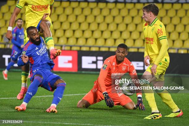 Lyon's French forward Alexandre Lacazette shoots and scores a goal during the French L1 football match between FC Nantes and Olympique Lyonnais at...