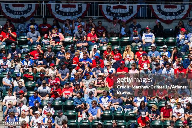 Fans sit in the bleachers at Truist park in the fifth inning during the game between the Atlanta Braves and the Arizona Diamondbacks at Truist Park...