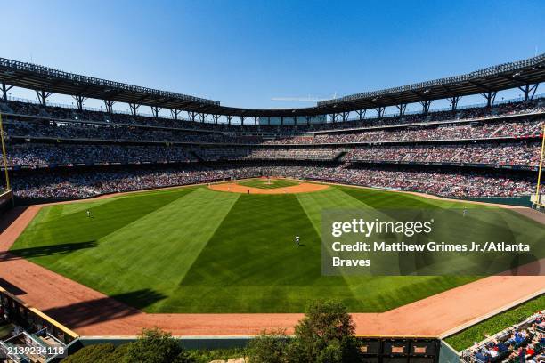 Fans sit in the bleachers at Truist park in the sixth inning during the game between the Atlanta Braves and the Arizona Diamondbacks at Truist Park...