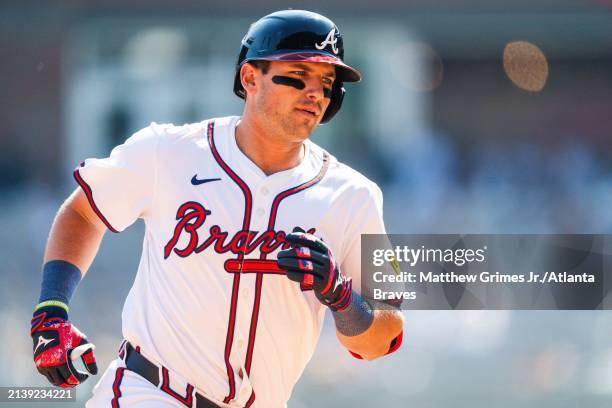 Austin Riley of the Atlanta Braves rounds the bases after hitting a home run against the Arizona Diamondbacks at Truist Park on April 7, 2024 in...