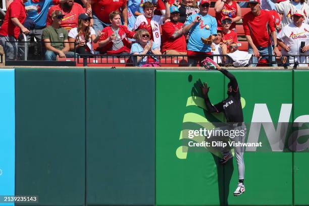 Jazz Chisholm Jr. #2 of the Miami Marlins attempts to catch a fly ball against the St. Louis Cardinals in the fifth inning at Busch Stadium on April...