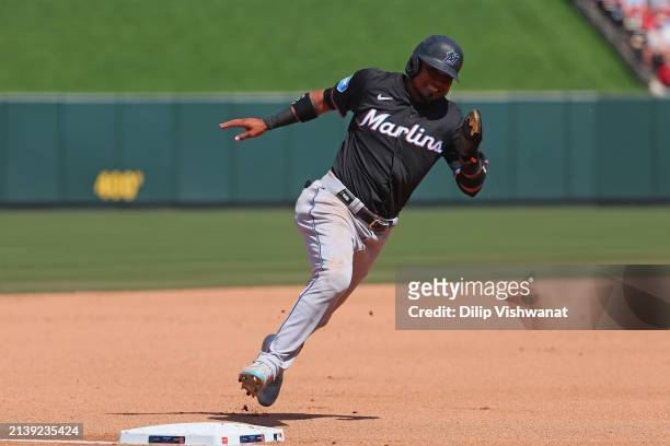 Luis Arraez of the Miami Marlins rounds third base on his way to scoring a run against the St. Louis Cardinals in the seventh inning at Busch Stadium...