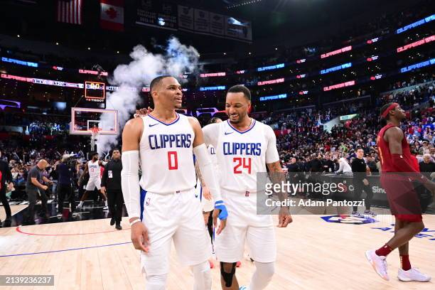 Russell Westbrook of the LA Clippers and Norman Powell of the LA Clippers celebrate after the game against the Cleveland Cavaliers on April 7, 2024...