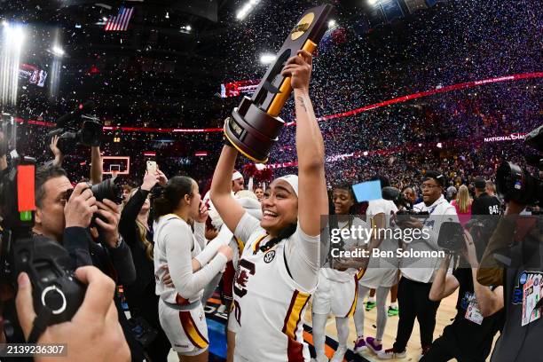 Te-Hina Paopao of the South Carolina Gamecocks celebrates with the trophy after defeating the Iowa Hawkeyes during the NCAA Women's Basketball...