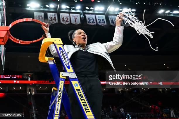 Head coach Dawn Staley of the South Carolina Gamecocks cuts down the net after defeating the Iowa Hawkeyesduring the NCAA Women's Basketball...