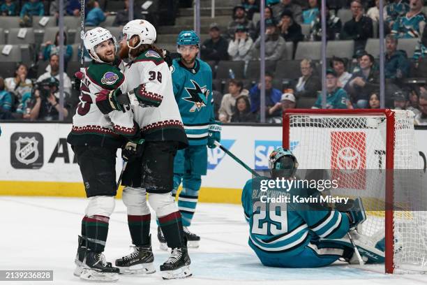 Liam O'Brien and Alex Kerfoot of the Arizona Coyotes celebrate scoring a goal in the first period against the San Jose Sharks at SAP Center on April...