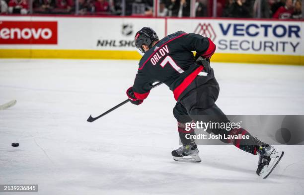 Dmitry Orlov of the Carolina Hurricanes shoots the puck during the second period against the Columbus Blue Jackets at PNC Arena on April 7, 2024 in...