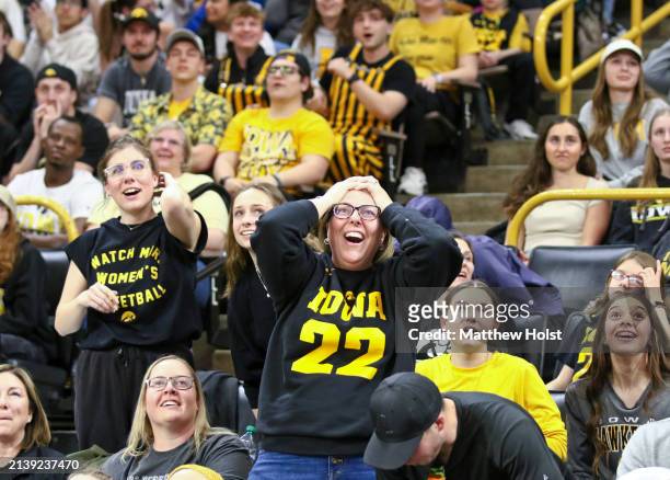 Whitney Olson, of Galva, Ill cheers along with fans watching the match-up between the South Carolina Gamecocks and the Iowa Hawkeyes during the 2024...