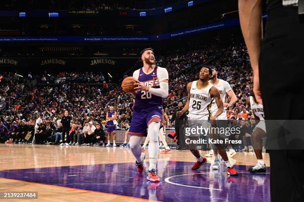 Jusuf Nurkic of the Phoenix Suns handles the ball during the game against the New Orleans Pelicans on April 7, 2024 at Footprint Center in Phoenix,...