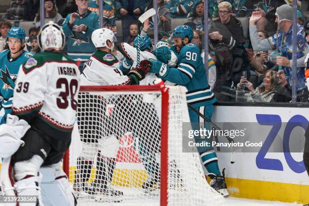 Luke Kunin and Justin Bailey of the San Jose Sharks in a fight with Juuso Valimaki and Josh Brown of the Arizona Coyotes during a game against the...