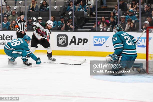 Liam O'Brien of the Arizona Coyotes sends the puck flying towards the net during the third period of a game against the San Jose Sharks at SAP Center...