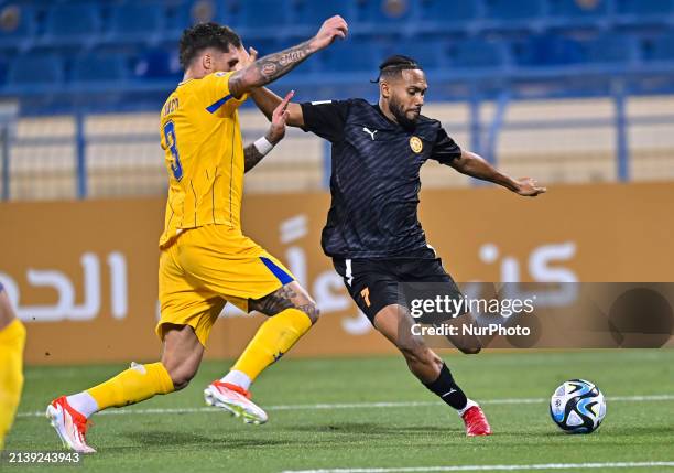 Lyanco Vojnovic of Al-Gharafa SC is battling for the ball with Kenji Joel of Umm Salal SC during the EXPO Stars League 23/24 match between Al-Gharafa...