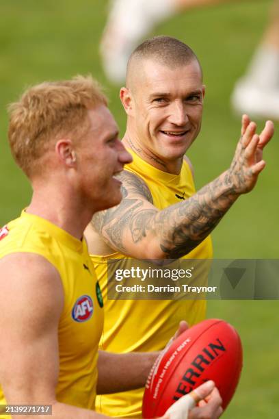 Dustin Martin shares a laugh with team mate Nick Vlastuin of the Tigers during a Richmond Tigers AFL training session at Punt Road Oval on April 05,...