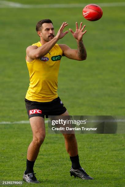 Jack Graham of the Tigers marks the ball during a Richmond Tigers AFL training session at Punt Road Oval on April 05, 2024 in Melbourne, Australia.