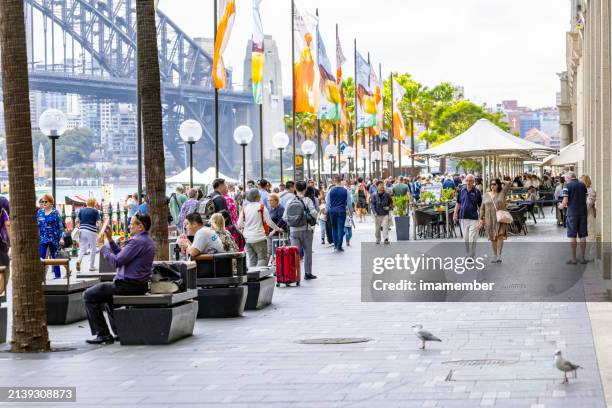 people enjoiyng sunny day in city, background with copy space - australasia stock pictures, royalty-free photos & images