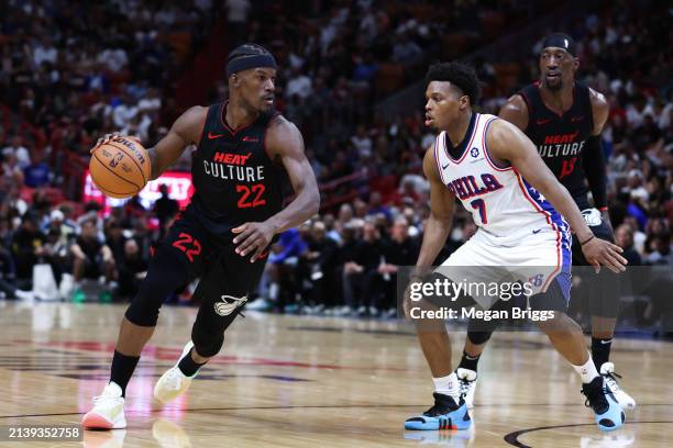Jimmy Butler of the Miami Heat dribbles the ball against Kyle Lowry of the Philadelphia 76ers during the second quarter of the game at Kaseya Center...