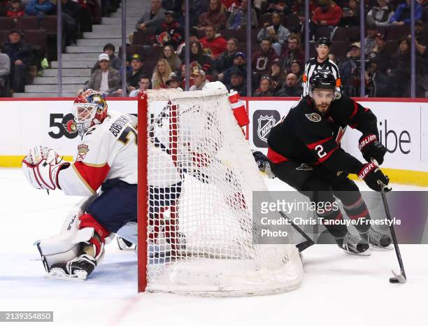 Artem Zub of the Ottawa Senators skates the puck behind the net of goaltender Sergei Bobrovsky of the Florida Panthers in the second period at...