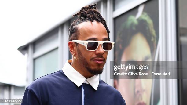 Lewis Hamilton of Great Britain and Mercedes walks in the Paddock prior to practice ahead of the F1 Grand Prix of Japan at Suzuka International...