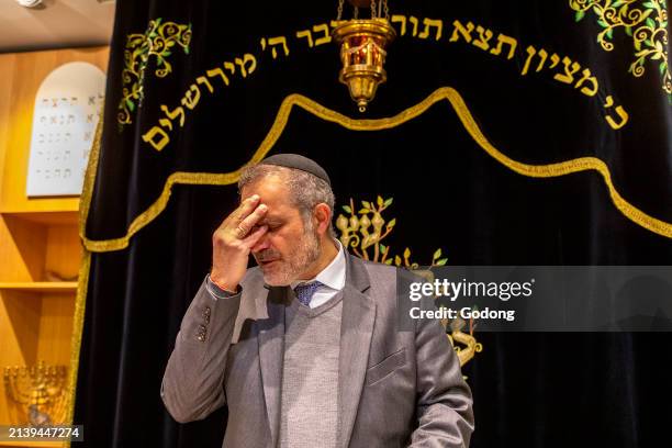 Purim celebration in Beth Yaacov synagogue, Paris, France. Rabbi Gabriel Farhi saying Shema Israel prayer.