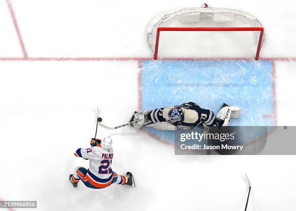 Jet Greaves of the Columbus Blue Jackets defends against Kyle Palmieri of the New York Islanders during the third period at Nationwide Arena on April...