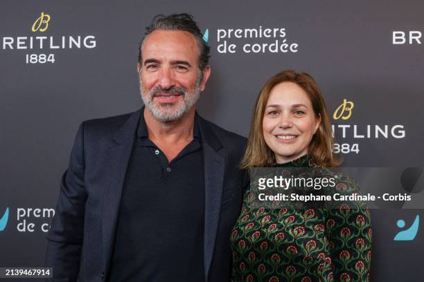 Jean Dujardin and Nathalie Péchalat attend the "Breitling x Premiers de Cordée" Charity Dinner At La Samaritaine on April 04, 2024 in Paris, France.