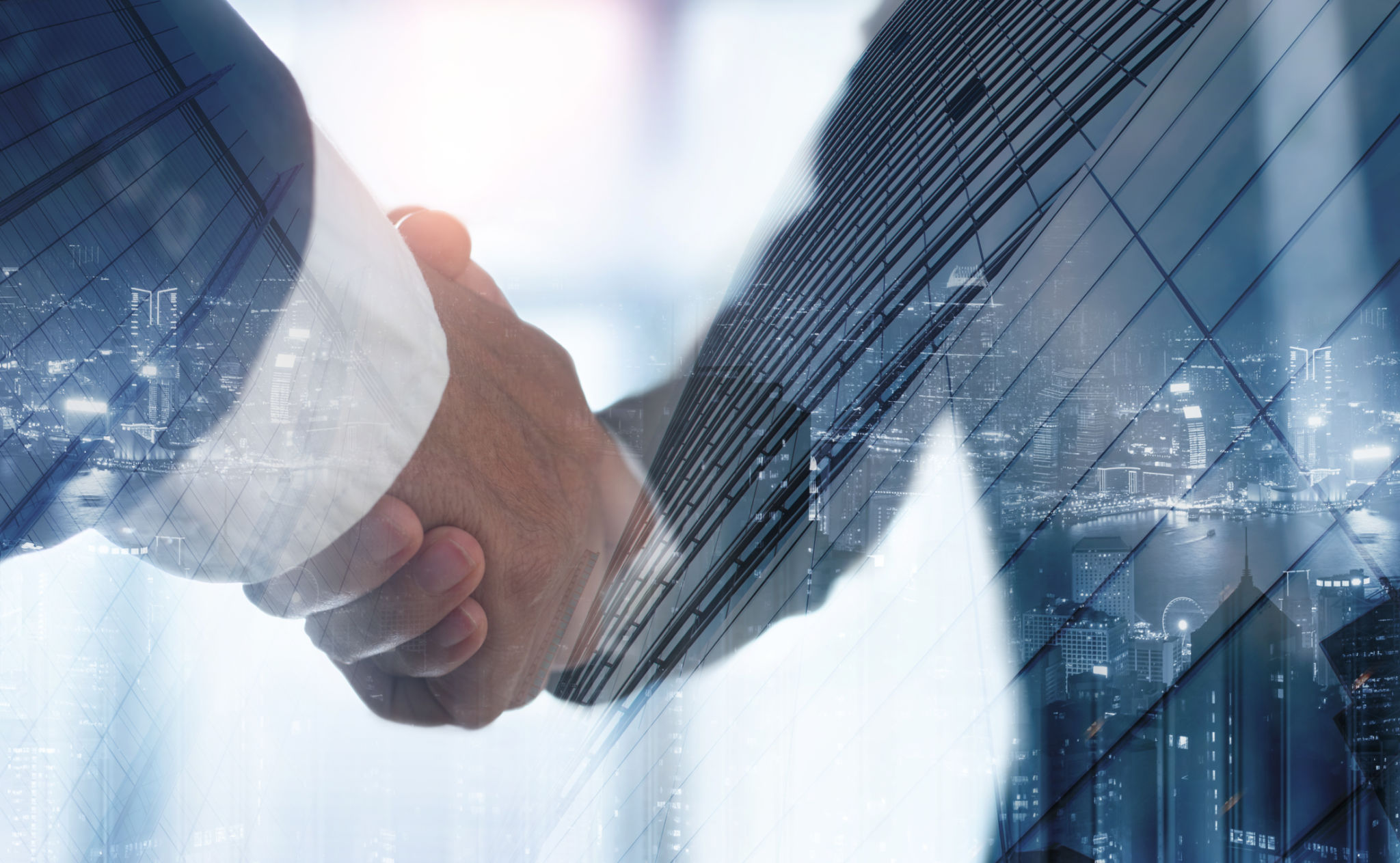 Double exposure of business handshake for successful of investment deal and the city, business teamwork and partnership concept. Businessmen making a handshake, business finanace and investment background Double exposure of business handshake for successful of investment deal and the city, business teamwork and partnership concept. Businessmen making a handshake, business finanace and investment background