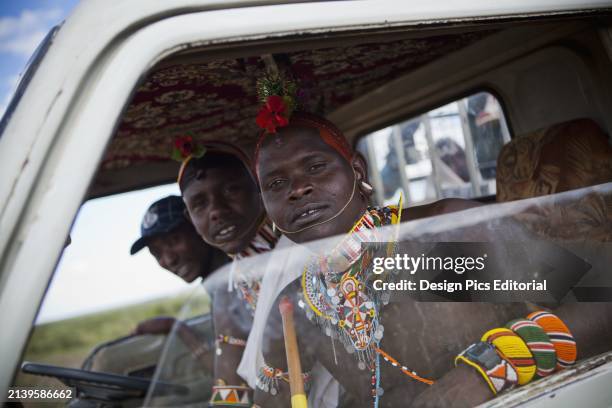 Kenya, View of a young Samburu warriors in lorry cab; Near Maralal.