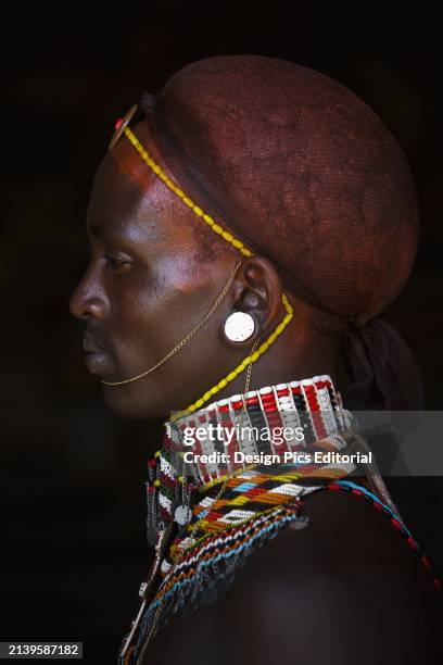 Kenya, Portrait of a young Samburu man in traditional dress; South Horr.