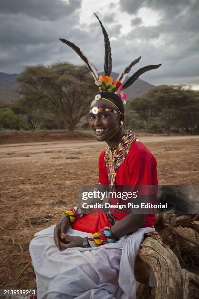 Kenya, Portrait of a young Samburu Moran in traditional dress; South Horr.