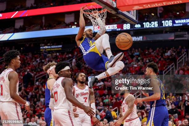 Moses Moody of the Golden State Warriors dunks the ball in the second half against the Houston Rockets at Toyota Center on April 04, 2024 in Houston,...