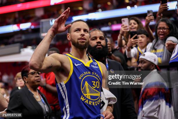 Stephen Curry of the Golden State Warriors waves to the crowd after the game against the Houston Rockets at Toyota Center on April 04, 2024 in...