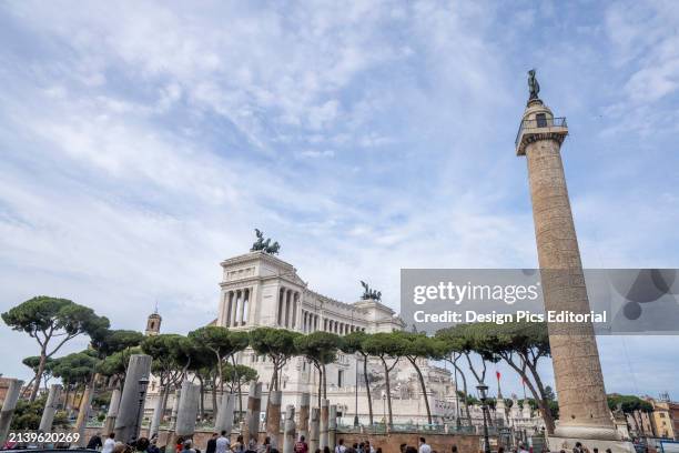 Trajan's Column and Victor Emmanuel II National Monument in the Piazza Venezia of Rome. Rome, Italy.